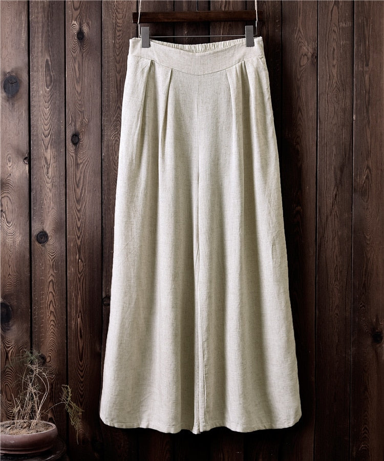 Pantaloni larghi a vita alta in lino da donna. Eleganti e versatili, questi pantaloni in lino a vita alta offrono una vestibilità comoda e sofisticata.