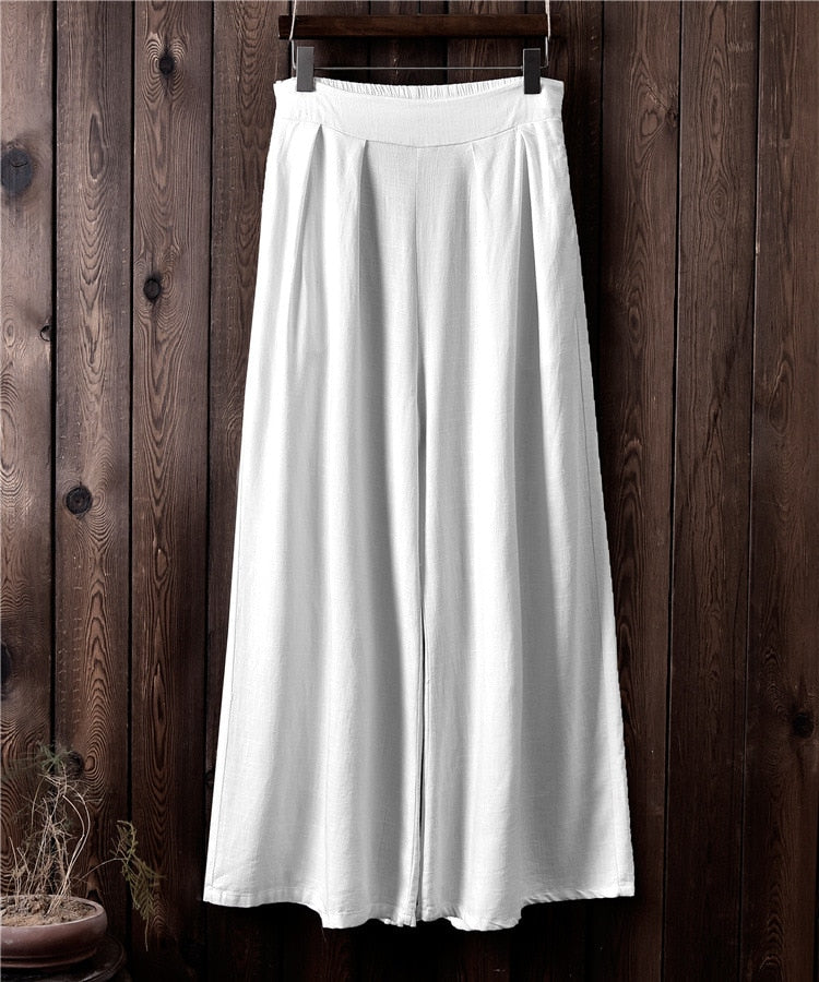 Pantaloni larghi a vita alta in lino da donna. Eleganti e versatili, questi pantaloni in lino a vita alta offrono una vestibilità comoda e sofisticata.