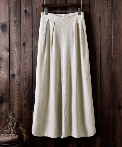 Pantaloni larghi a vita alta in lino da donna. Eleganti e versatili, questi pantaloni in lino a vita alta offrono una vestibilità comoda e sofisticata.